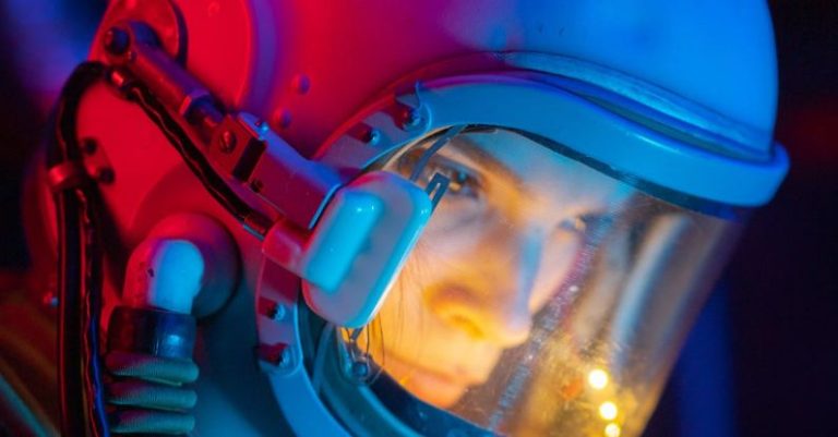 Interstellar Travel - Woman In Blue Space Suit